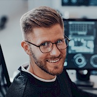 An AI engineer smiling