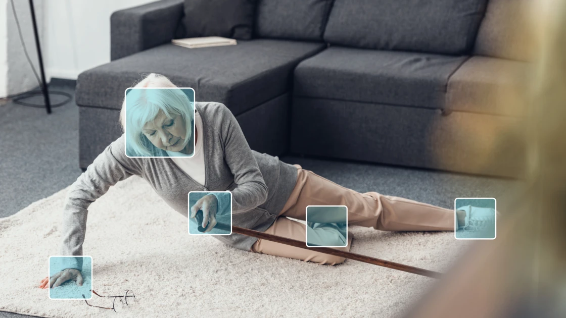 A older woman on the floor after a fall detected by AI.